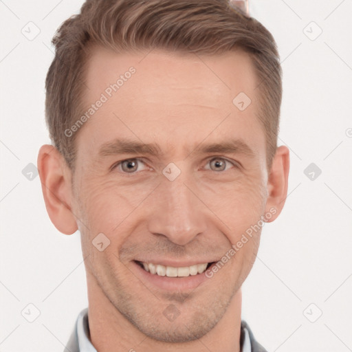 Joyful white adult male with short  brown hair and brown eyes