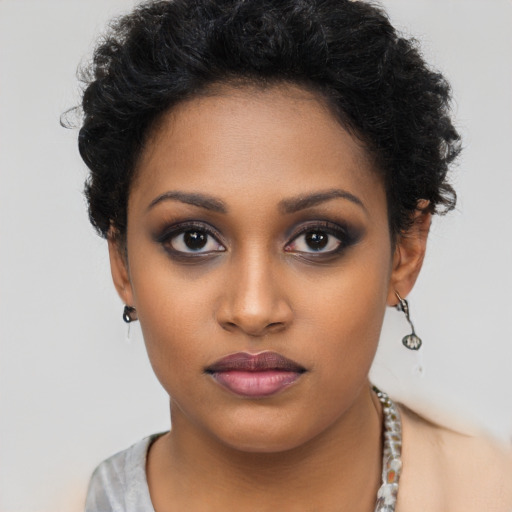 Neutral black young-adult female with short  black hair and brown eyes