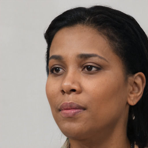 Neutral black young-adult female with long  black hair and brown eyes