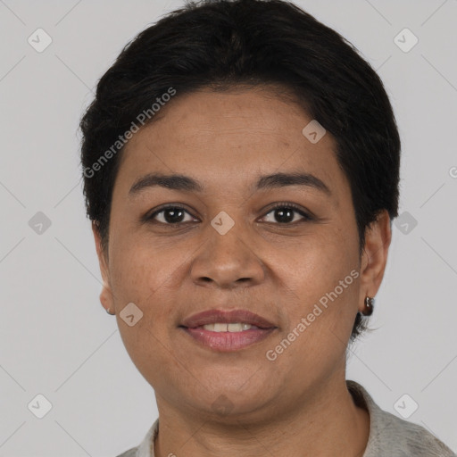 Joyful latino young-adult female with short  black hair and brown eyes
