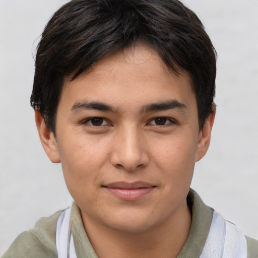Joyful asian young-adult male with short  brown hair and brown eyes