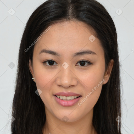 Joyful asian young-adult female with long  brown hair and brown eyes