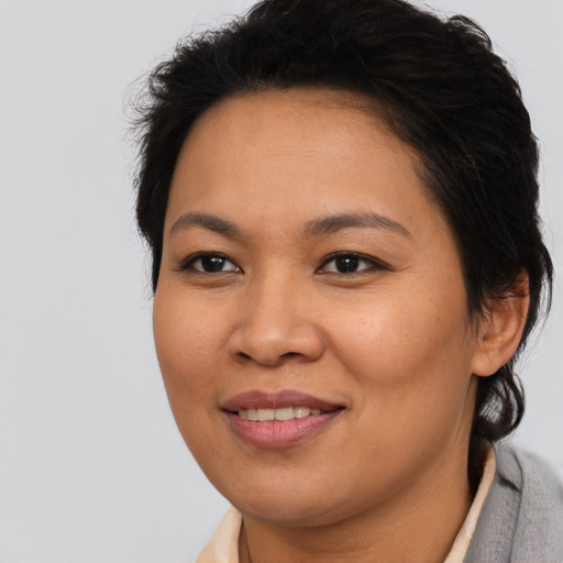 Joyful asian young-adult female with medium  brown hair and brown eyes