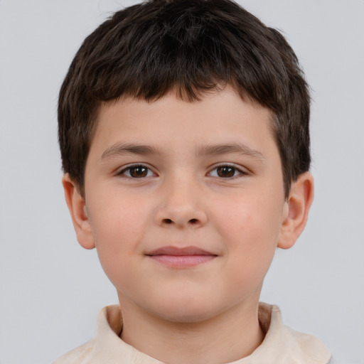 Joyful white child male with short  brown hair and brown eyes