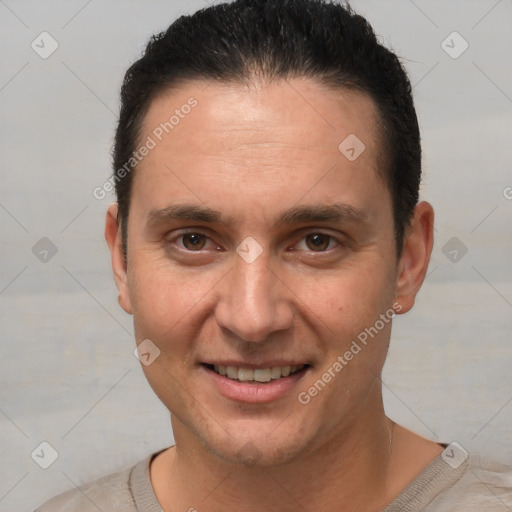 Joyful white adult male with short  brown hair and brown eyes