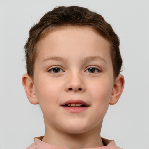 Joyful white child male with short  brown hair and brown eyes