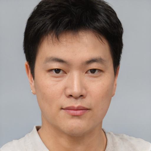 Neutral asian young-adult male with short  brown hair and brown eyes