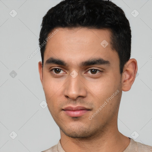 Neutral latino young-adult male with short  black hair and brown eyes