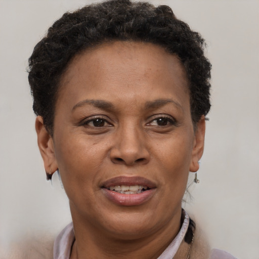 Joyful latino adult female with short  brown hair and brown eyes