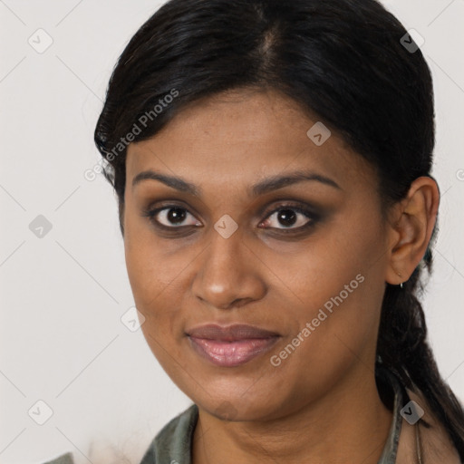 Joyful latino young-adult female with medium  brown hair and brown eyes