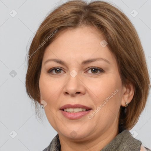 Joyful white adult female with medium  brown hair and brown eyes