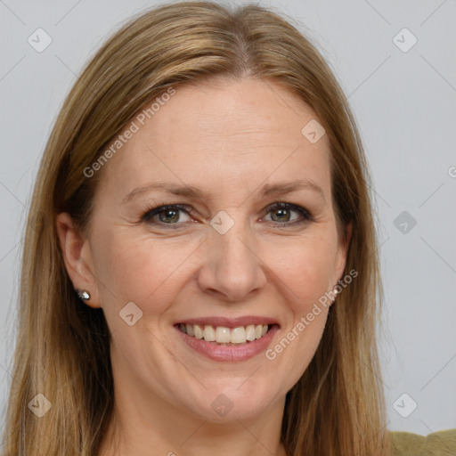 Joyful white adult female with long  brown hair and grey eyes