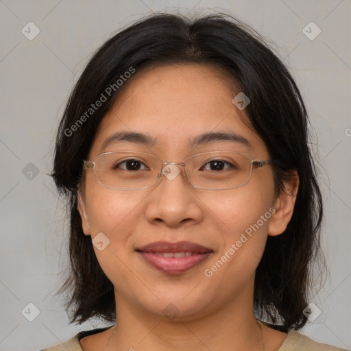 Joyful white adult female with medium  brown hair and brown eyes