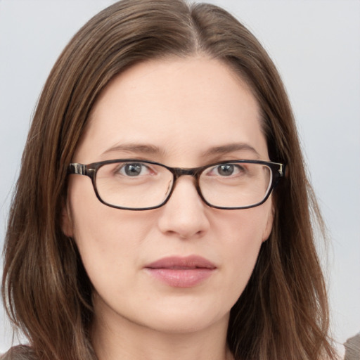 Neutral white young-adult female with long  brown hair and blue eyes