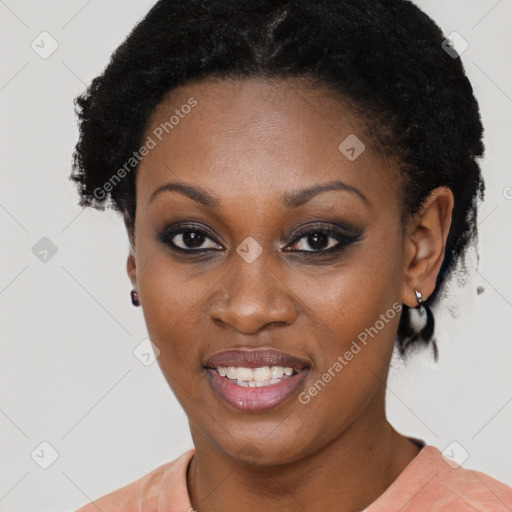 Joyful black young-adult female with short  black hair and brown eyes