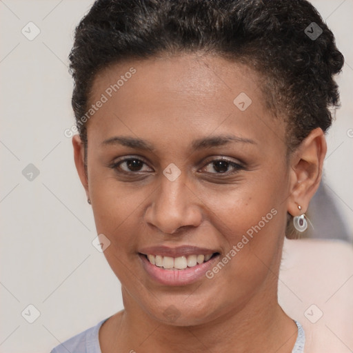 Joyful latino young-adult female with short  brown hair and brown eyes