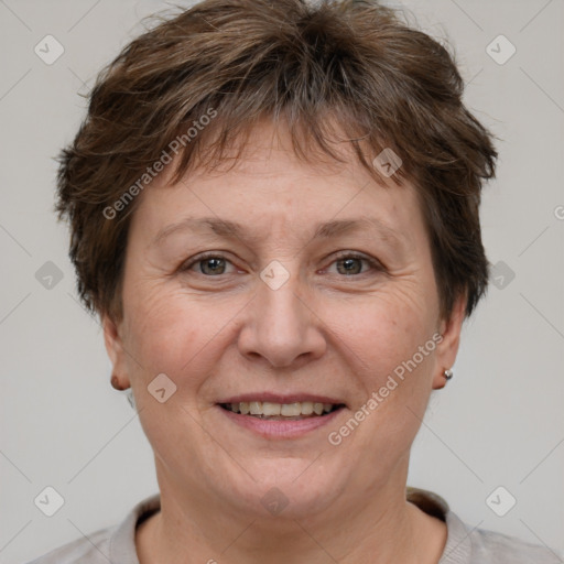 Joyful white adult female with short  brown hair and brown eyes