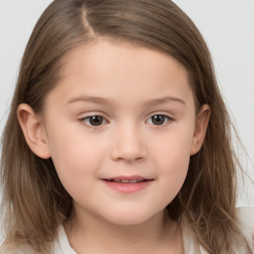 Joyful white child female with medium  brown hair and brown eyes