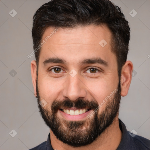 Joyful white young-adult male with short  brown hair and brown eyes