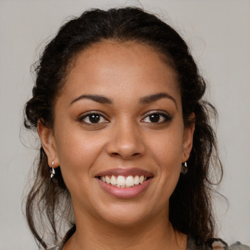 Joyful white young-adult female with medium  brown hair and brown eyes