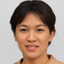 Joyful asian young-adult female with short  brown hair and brown eyes