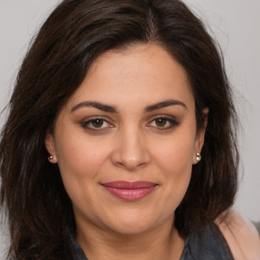 Joyful white young-adult female with medium  brown hair and brown eyes