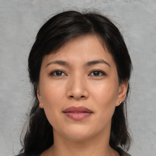 Joyful asian young-adult female with medium  black hair and brown eyes