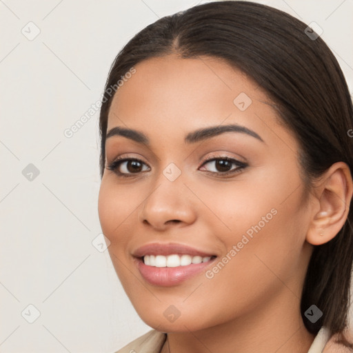 Joyful latino young-adult female with long  brown hair and brown eyes