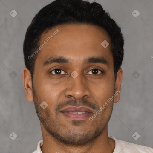 Joyful latino young-adult male with short  brown hair and brown eyes