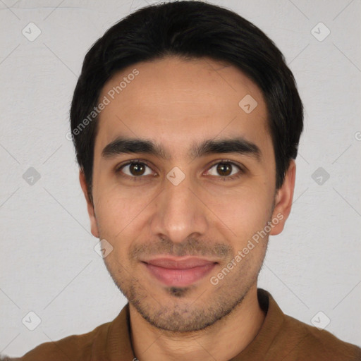 Joyful white young-adult male with short  black hair and brown eyes