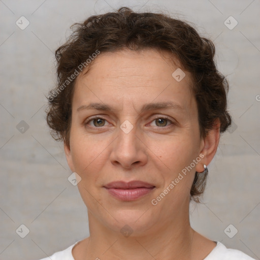 Joyful white adult female with short  brown hair and brown eyes