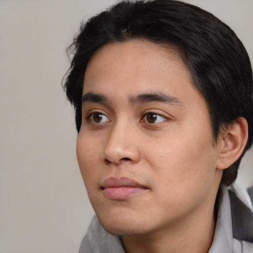 Neutral white young-adult male with short  black hair and brown eyes