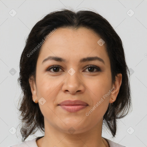 Joyful latino young-adult female with medium  brown hair and brown eyes