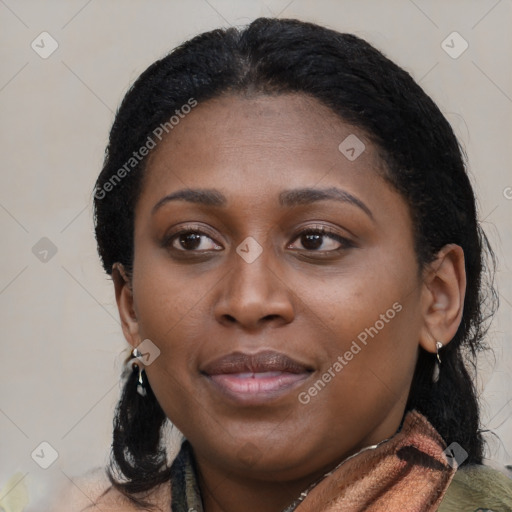 Joyful black young-adult female with long  brown hair and brown eyes