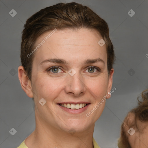 Joyful white adult female with short  brown hair and grey eyes