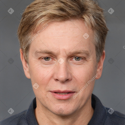 Joyful white adult male with short  brown hair and grey eyes