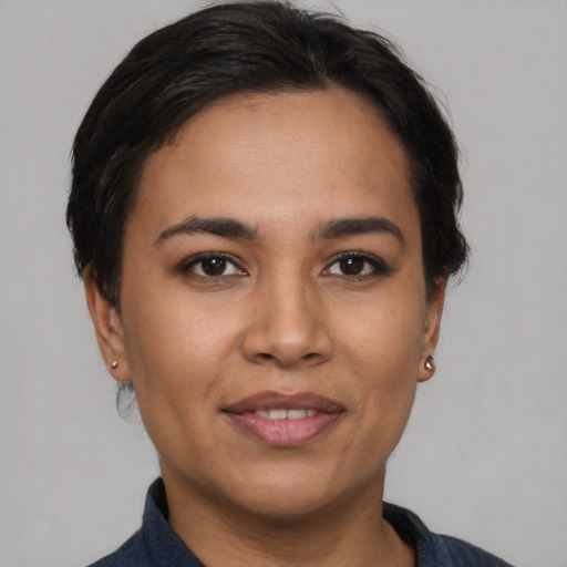 Joyful asian young-adult female with short  brown hair and brown eyes