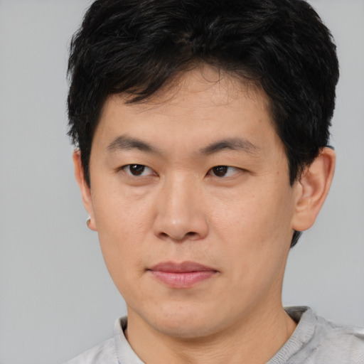 Neutral asian young-adult male with short  brown hair and brown eyes