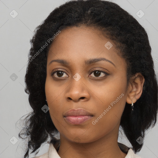 Joyful black young-adult female with medium  brown hair and brown eyes