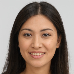 Joyful white young-adult female with long  brown hair and brown eyes