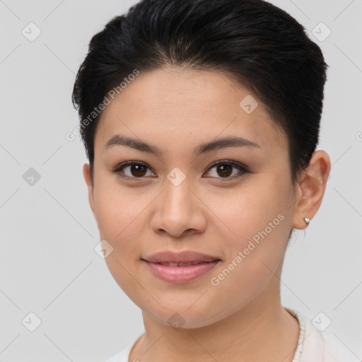 Joyful latino young-adult female with short  brown hair and brown eyes