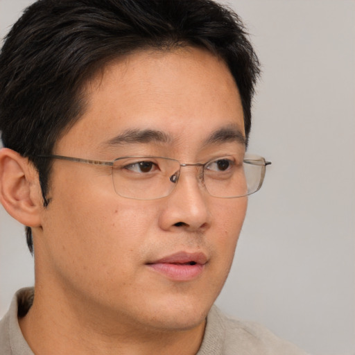 Neutral asian young-adult male with short  brown hair and brown eyes