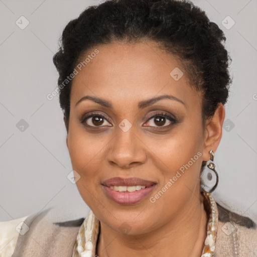 Joyful black young-adult female with short  brown hair and brown eyes