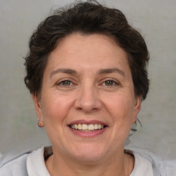 Joyful white adult female with short  brown hair and brown eyes