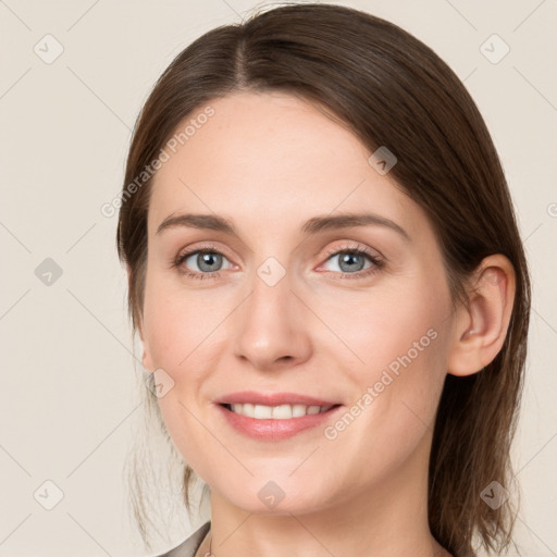 Joyful white young-adult female with medium  brown hair and grey eyes