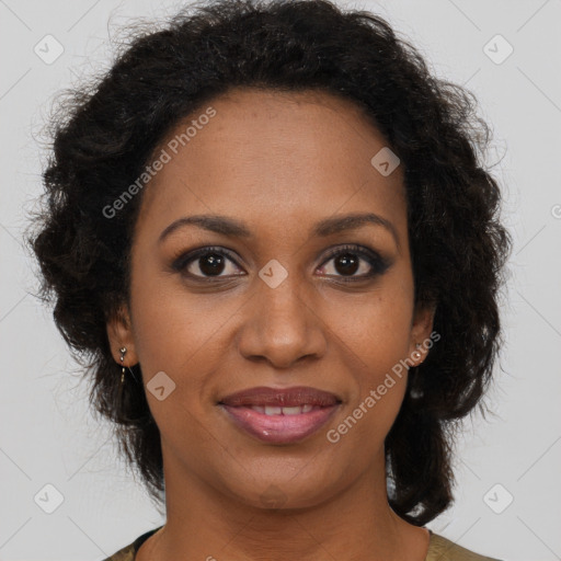 Joyful black young-adult female with long  brown hair and brown eyes