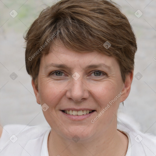 Joyful white adult female with short  brown hair and brown eyes