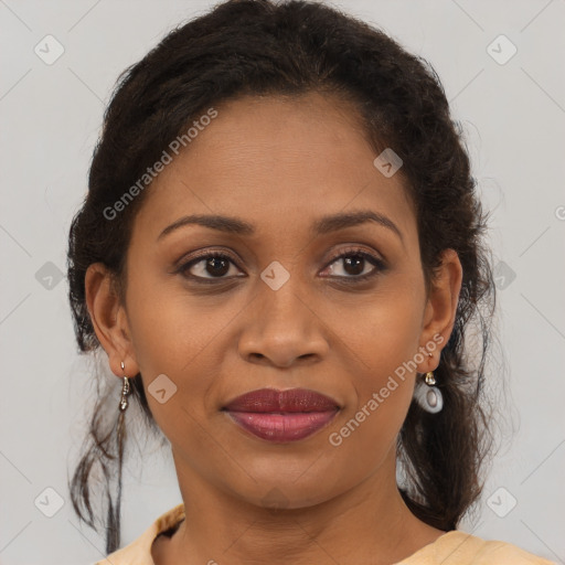 Joyful black adult female with medium  brown hair and brown eyes