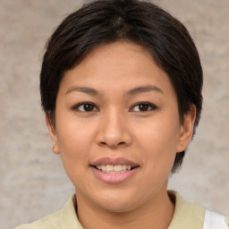 Joyful asian young-adult female with short  brown hair and brown eyes