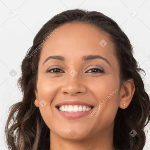 Joyful latino young-adult female with long  brown hair and brown eyes